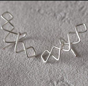 Boucles d'oreilles "Crowned V »